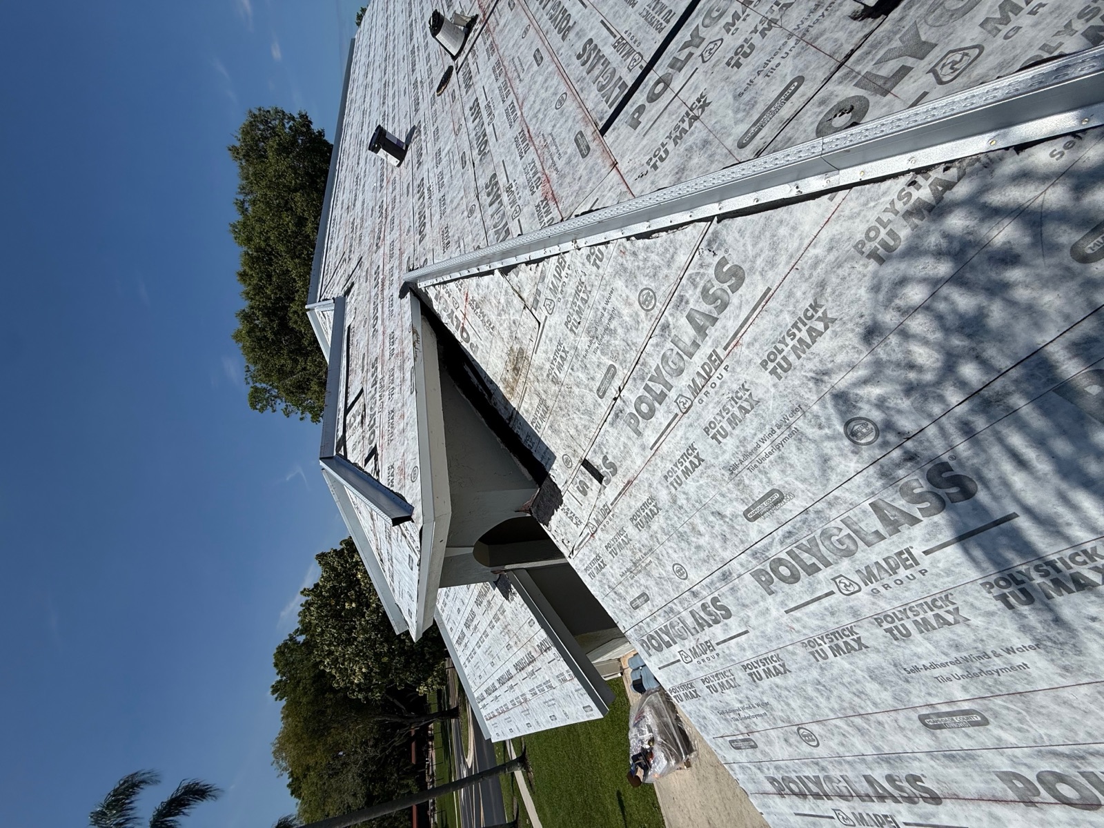 Roof underlayment installation in progress